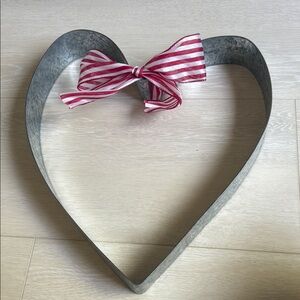 Heart-Shaped Metal Wreath with Red and White Bow